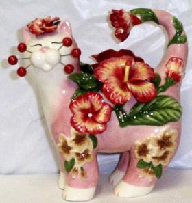 Pink cat figurine with hibiscus flowers