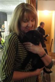 Owner Lanette Orduna holding a black cat